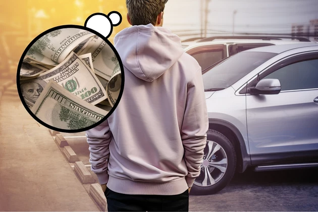 man thinking about money while looking at a car