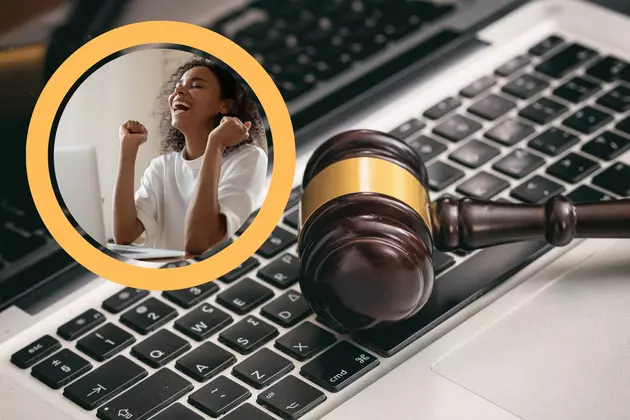 laptop keyboard, with a judge gavel, inner picture of a woman on computer celebrating