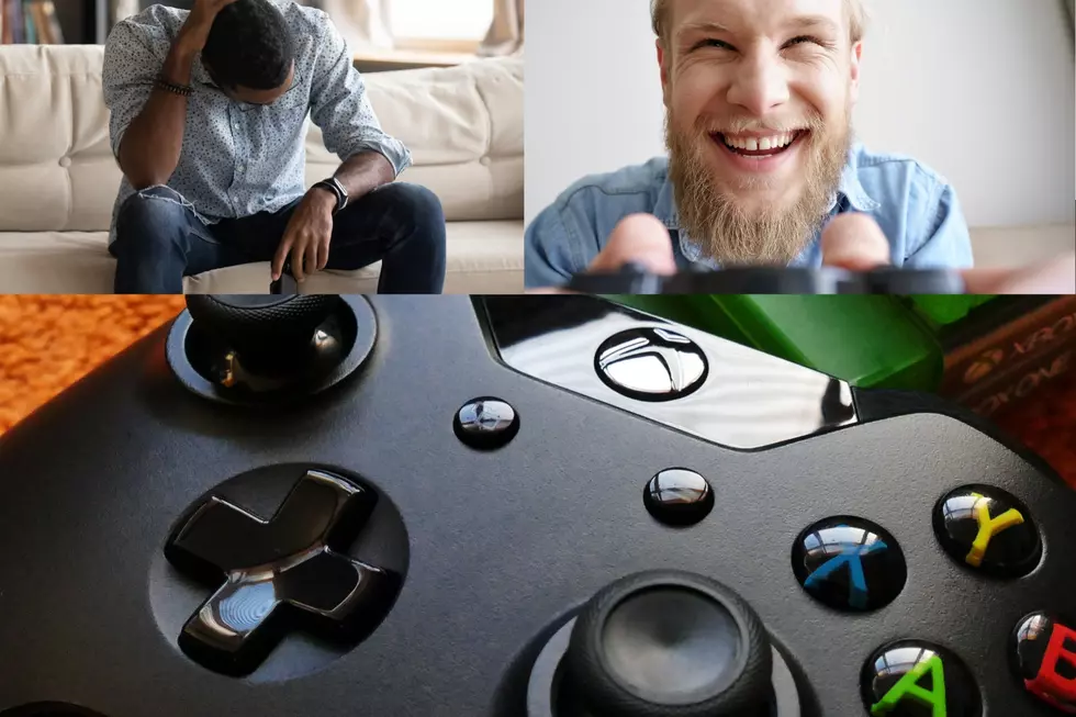 xbox video game controller. Two people playing games. One happy, one sad.