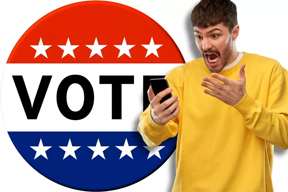 man in a yellow shirt, yelling at his phone. Big "VOTE" button in background